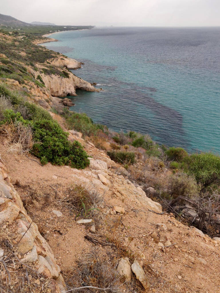 Running a trail on the cliff edges in the south of Sardinia, Italy