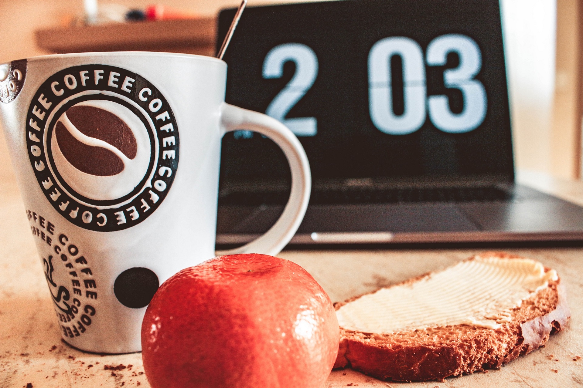 toast, fruit, coffee, and a clock