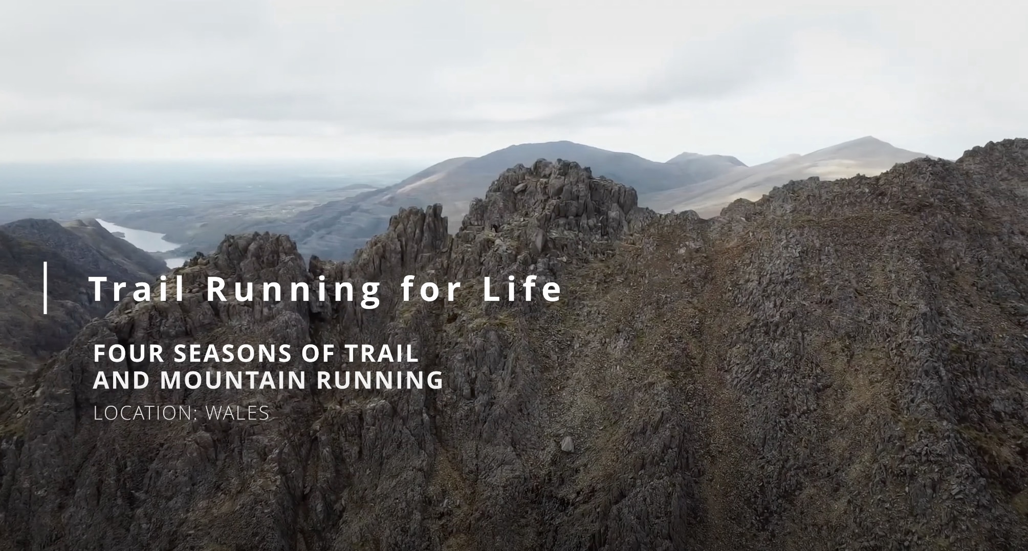 four seasons of trail running feature image. A photo of the Crib Goch mountain ridge line in the distance.